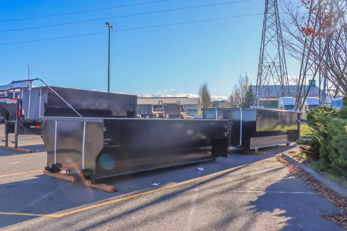 Roll-off dumpster ready for waste disposal at job site for Concrete Dumpster Rental in Spanish Fort